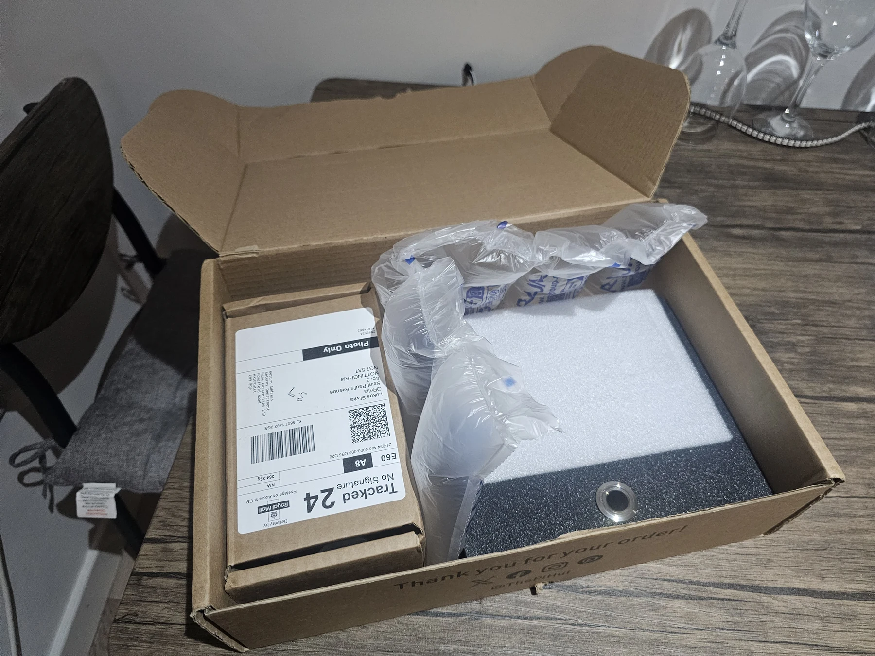 QRelia Pulse terminal packed in a shipping box